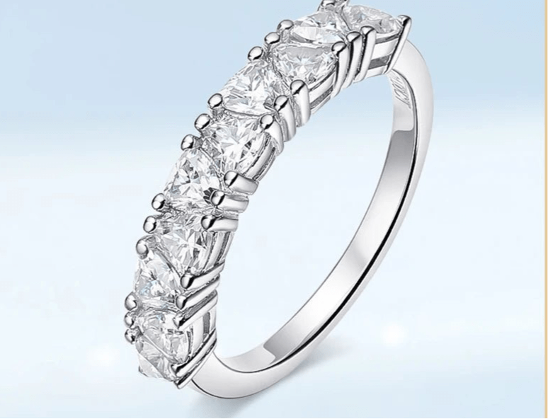 Silver ring featuring ten trillion-cut moissanite stones.