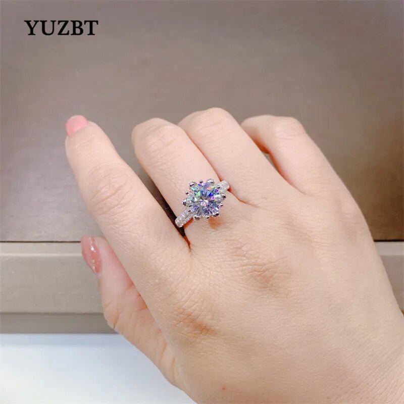 Hand wearing a 3 Carat Moissanite Blossom Ring with 18K White Gold Plated band.