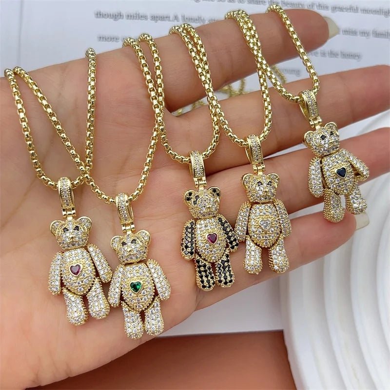 Crystal teddy bear pendant necklaces with gold chain. Heart detail, various styles.