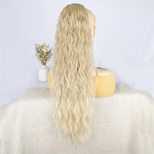 Blonde wavy long ponytail extension made of synthetic fiber, rear view.