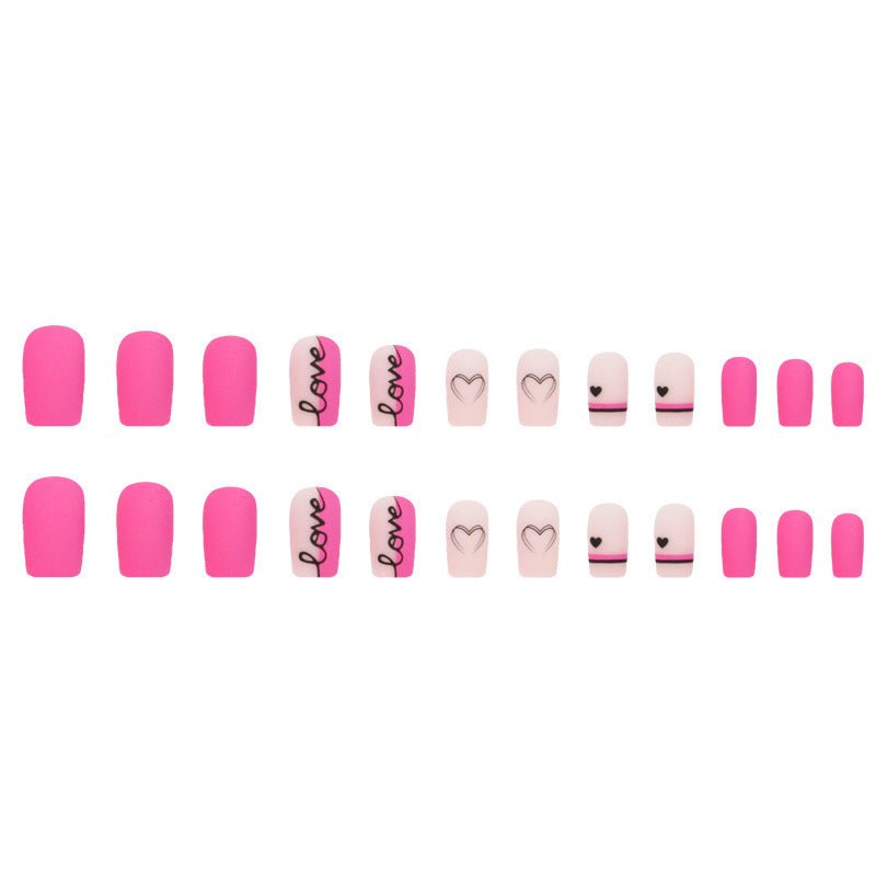 Valentine's Day press-on nails with pink, heart, and 'love' designs.