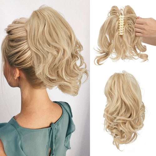 Blonde claw clip ponytail extension; synthetic hairpiece with wavy texture.