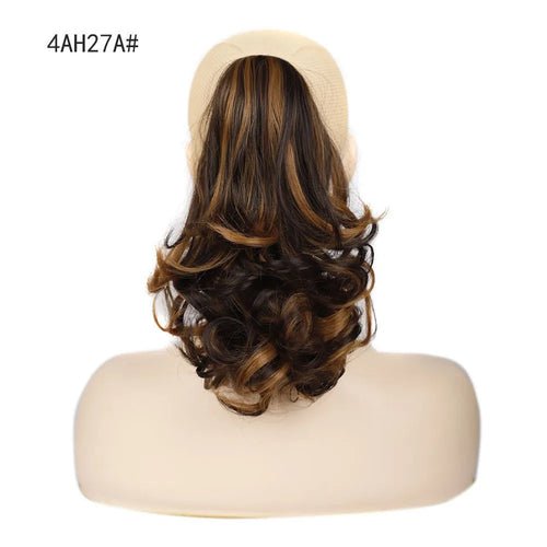 Brown and blonde synthetic claw clip ponytail hair extension with curly style.