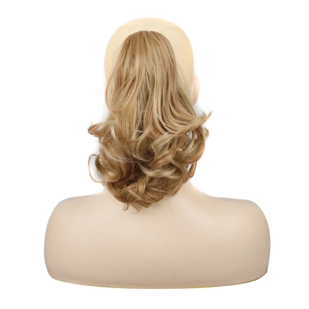 Blonde curly synthetic claw clip ponytail hair extension.