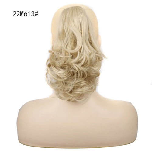 Blonde curly synthetic claw clip ponytail hair extension.