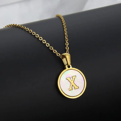 Gold stainless steel necklace with initial 'X' circle pendant.