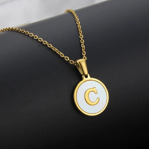 Gold stainless steel necklace with 'C' initial pendant on a delicate chain.
