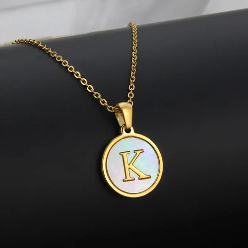 Gold initial necklace with a letter K pendant.