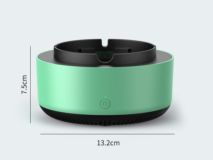 Mint green portable air purifier ashtray with power button. Dimensions: 7.5cm high, 13.2cm wide.